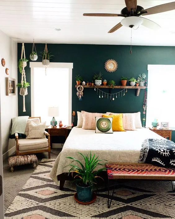 A green bedroom with plant in the bedroom 