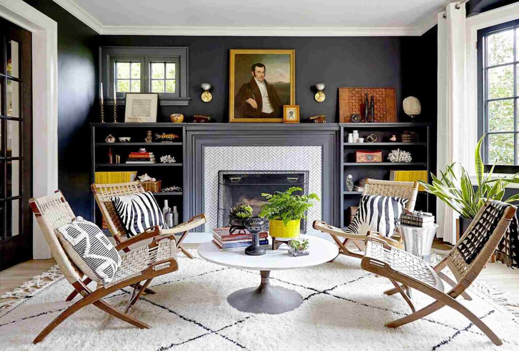 A living room with fireplace and white rug with chairs and table 