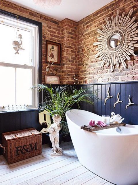 A bathroom with white bathtub and brick wall and white windows