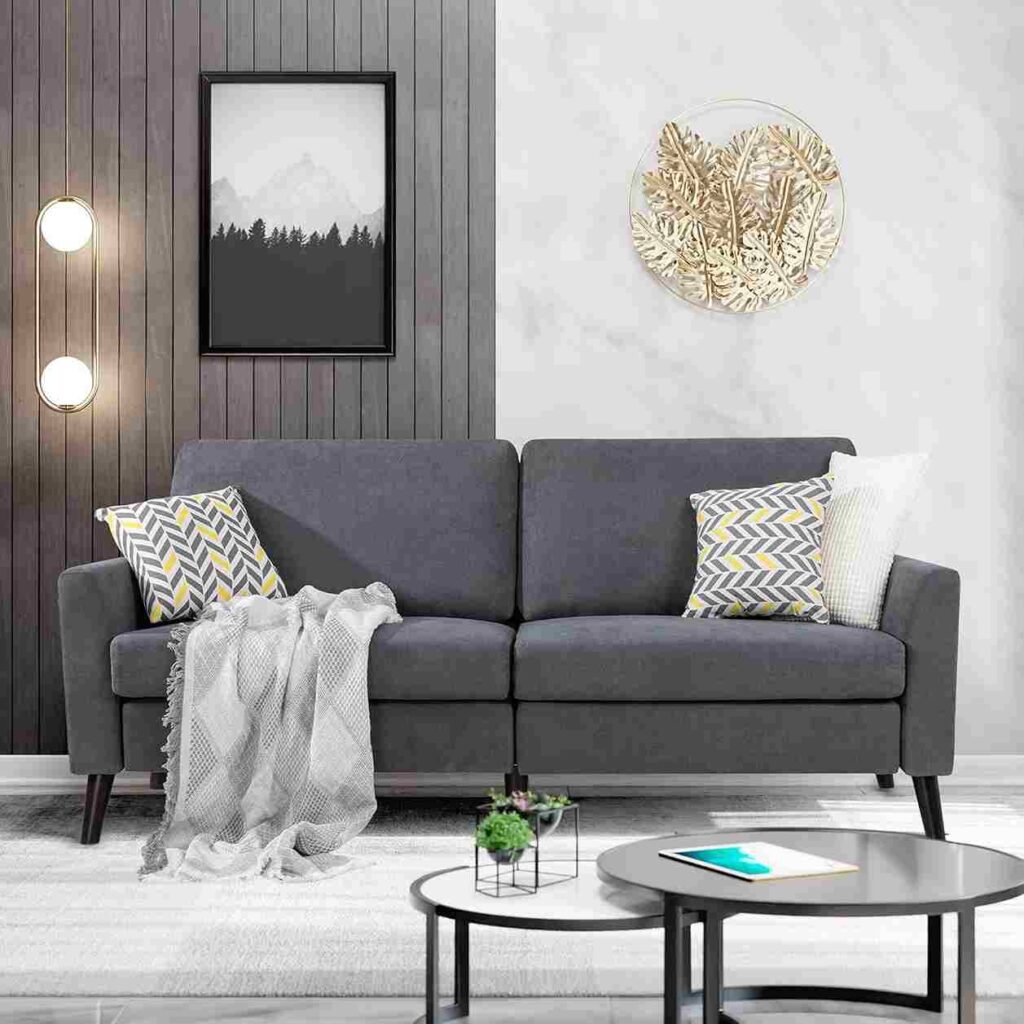 Grey upholstered sofa with throw pillow in living room 