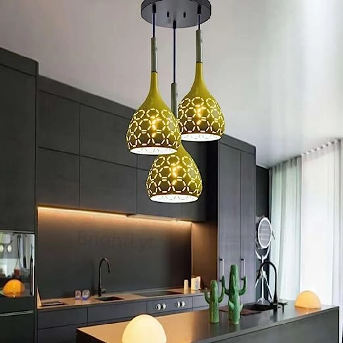 A black kitchen with gold light and under cabinet light 