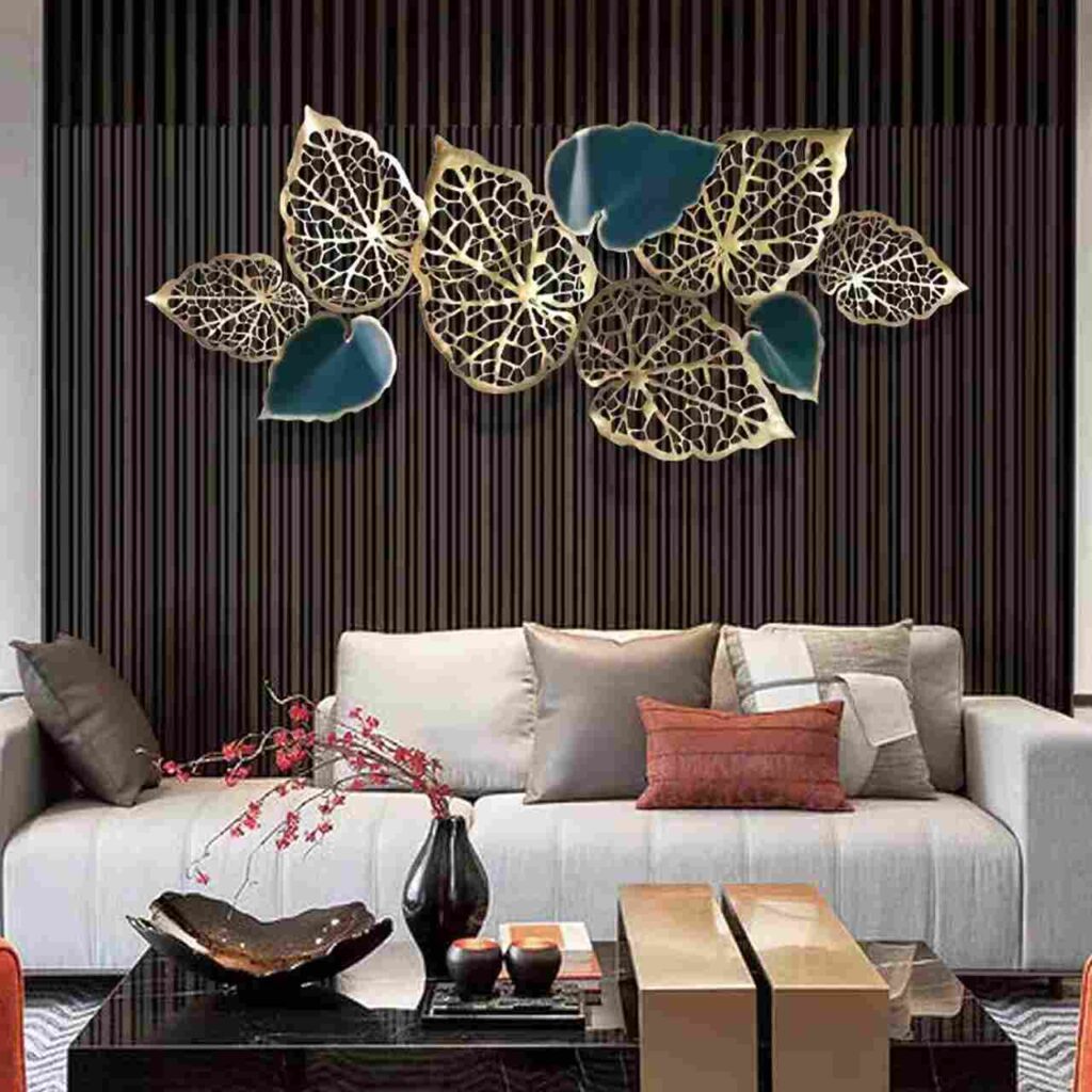 A living room with art on the floor and sofa with cushion 