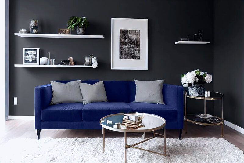 A navy blue sofa with table and charcoal living room