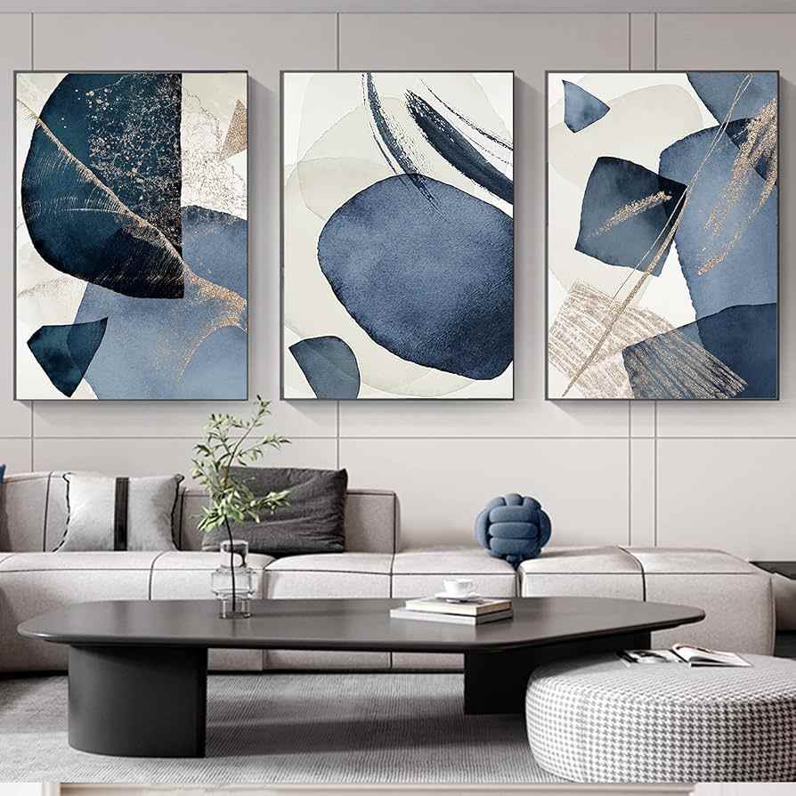 A grey living room with blue and grey artwork on the wall