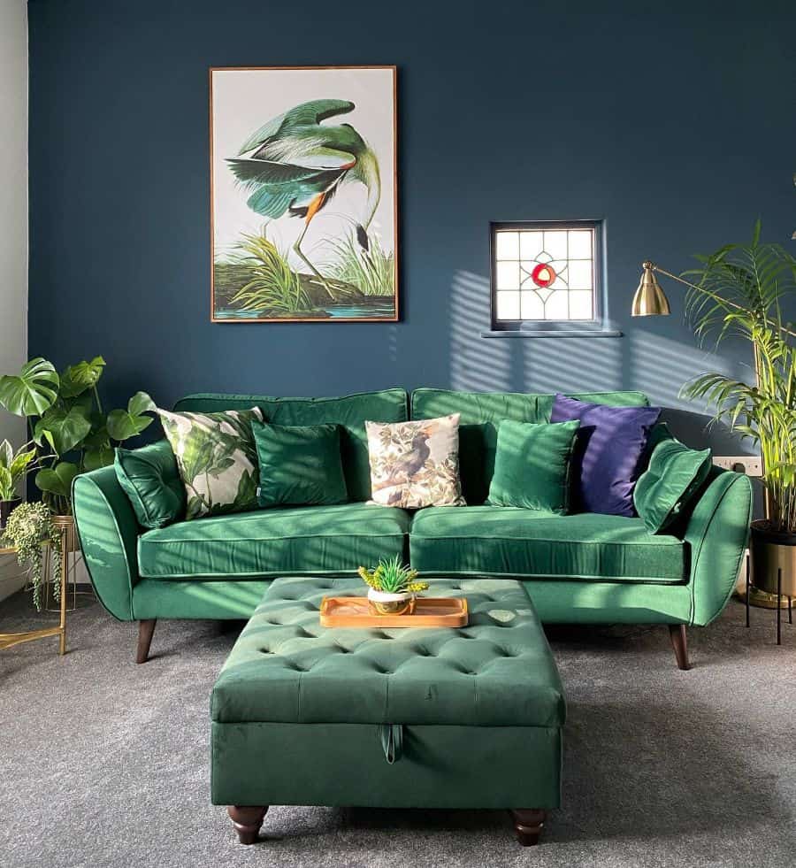 A navy blue living room with green accents 
