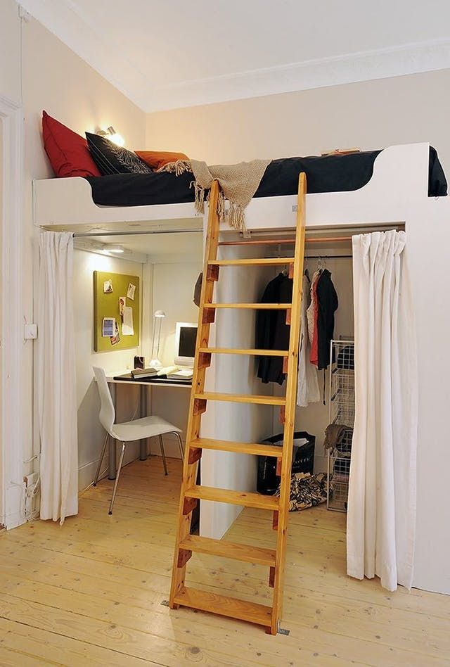 A loft bed with stairs and open closet and wooden floor 