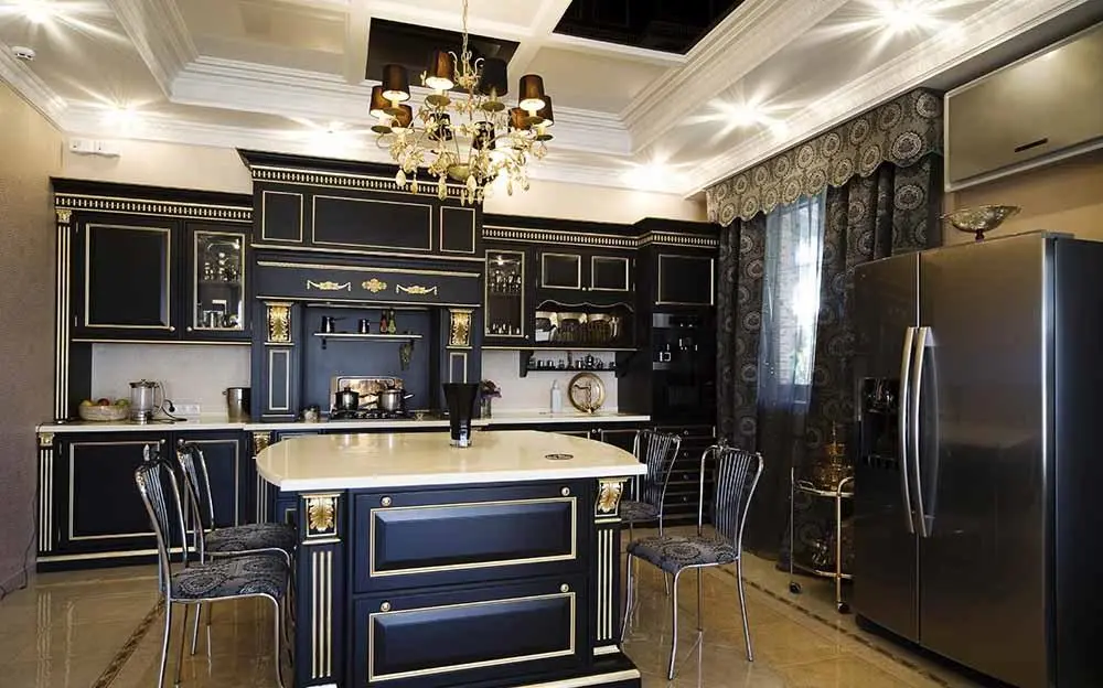 A black and gold accent kitchen and wooden floor 