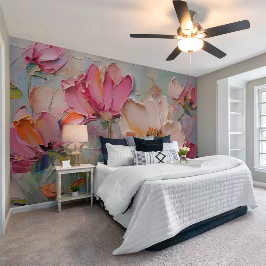 A bedroom with wallpaper wall and night stand and lamp on it 
