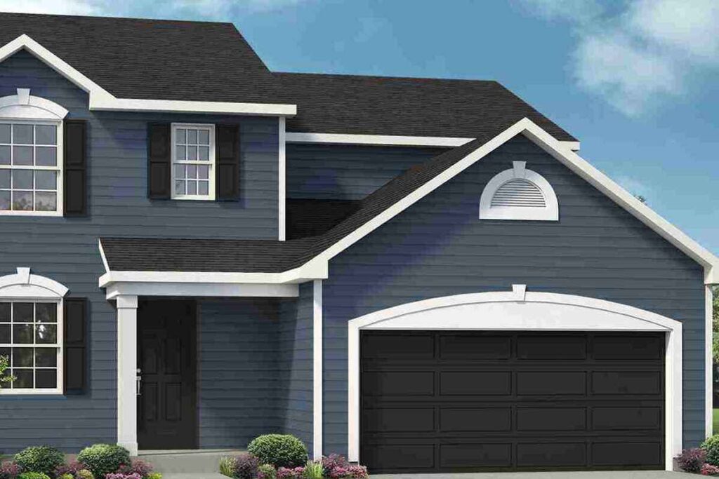 A black garage door on blue house with white trim 