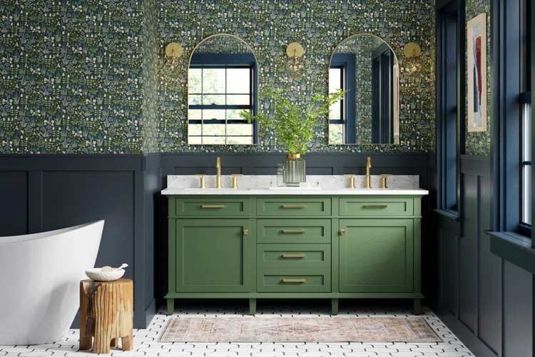 A green and blue bathroom with green vanity and gold fixture