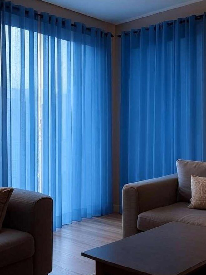 A sheer curtain with black rod in grey living room