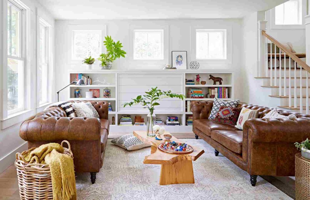 A living room with brown sofa and woven basket and windows 