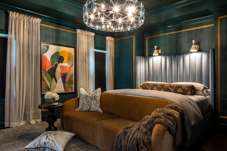 A green wall with trim in gothic bedroom with curtain and windows