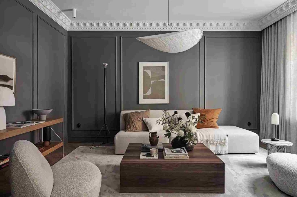A grey living room with sofa and table and wooden floor 