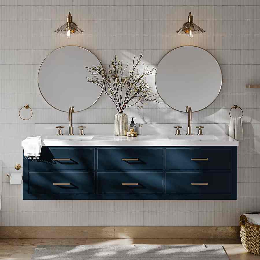 A navy blue vanity with white wall and mirror on the wall