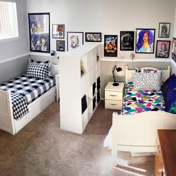A two bed with frames on the wall and wooden floor