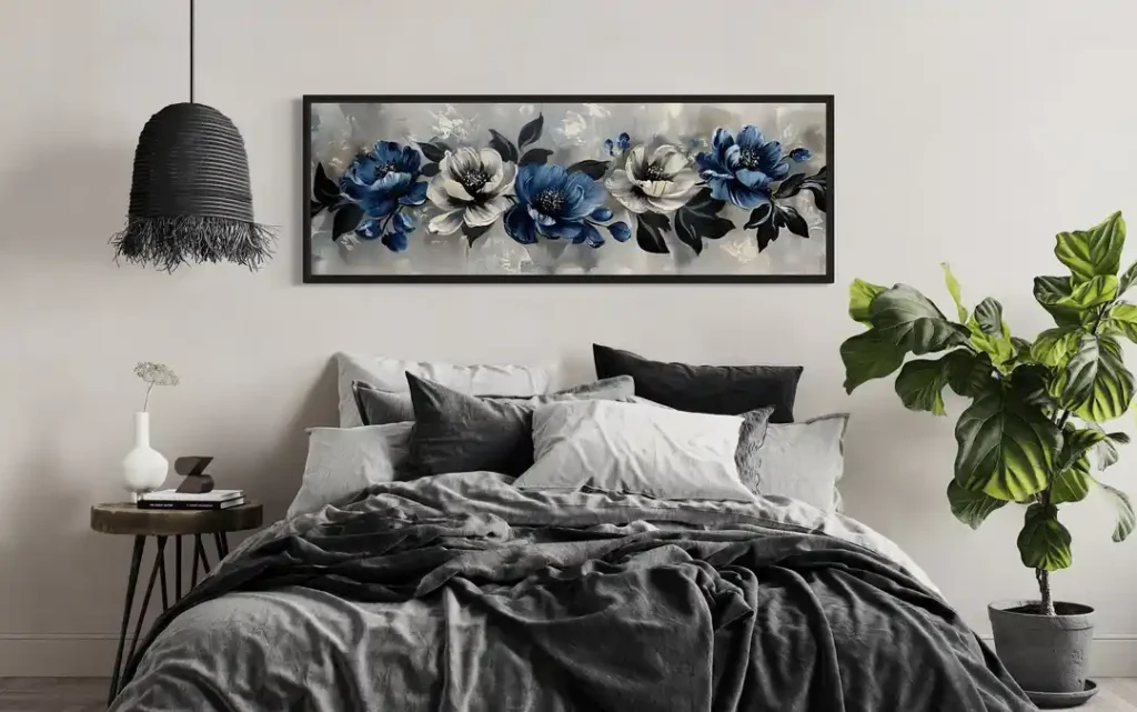 Grey and blue bedroom with artwork on the wall