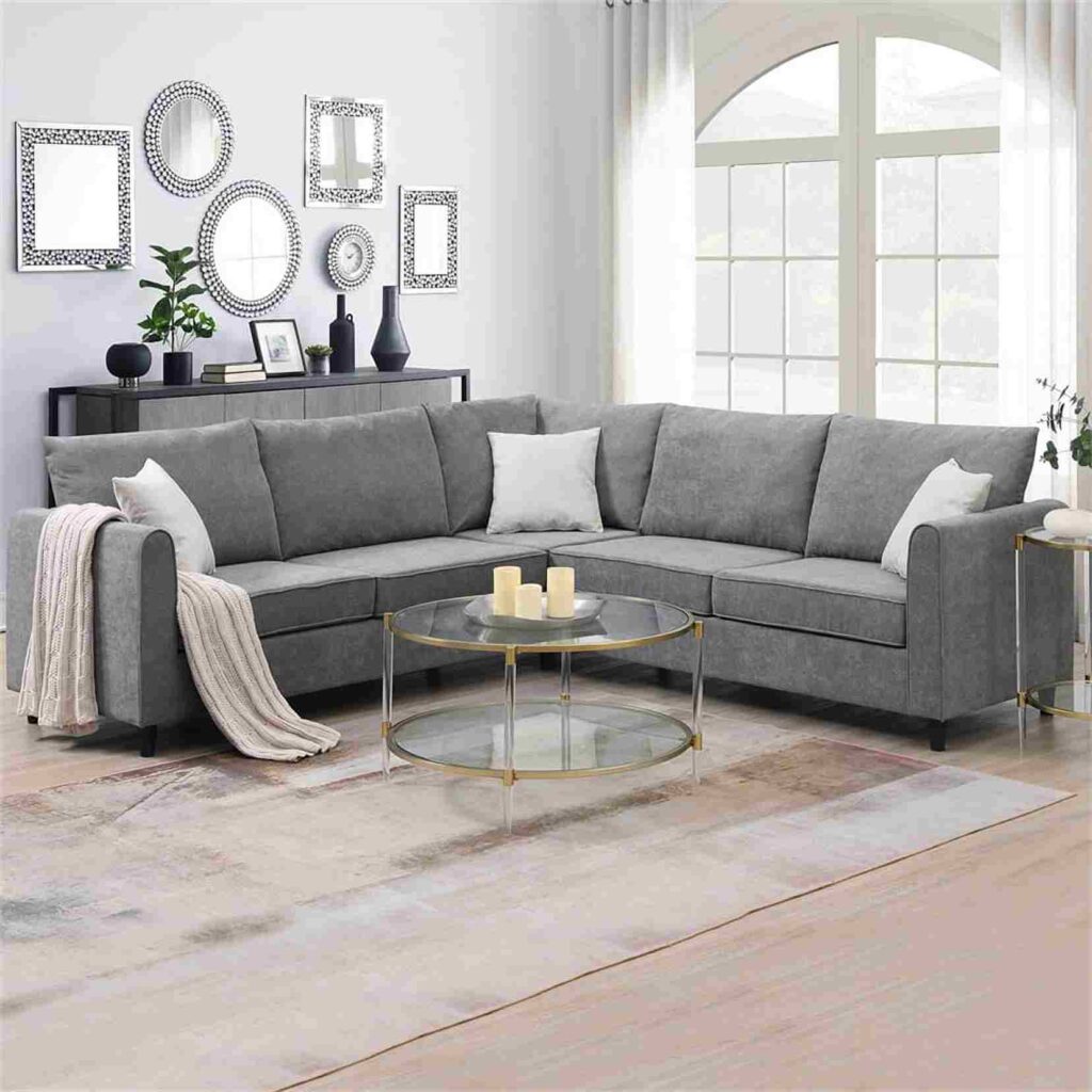 A grey living room with metallic accents on the wall 
