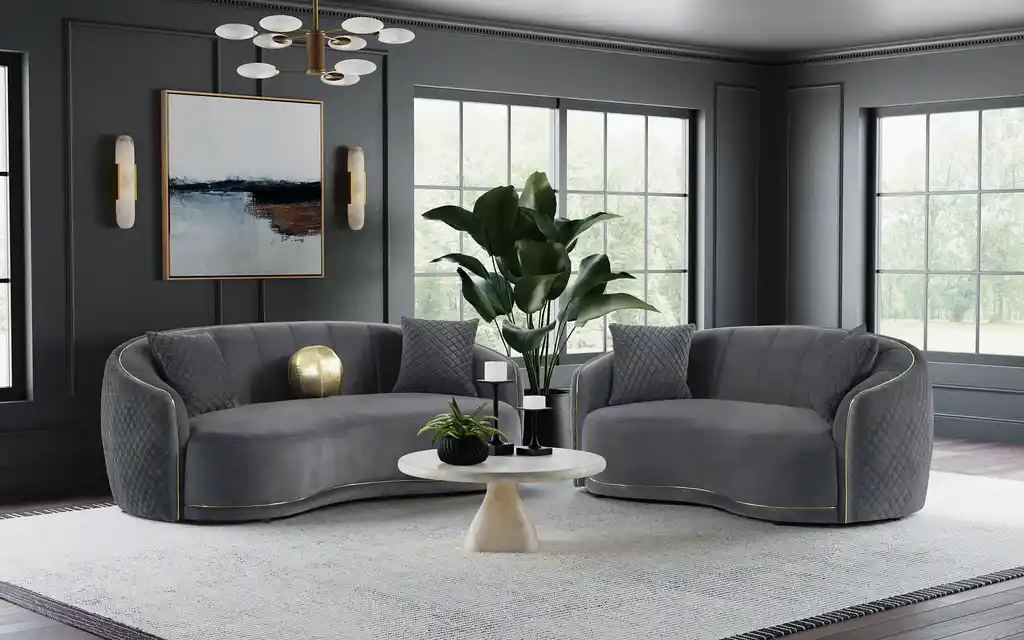 A grey living room with grey velvet upholstered sofa 
