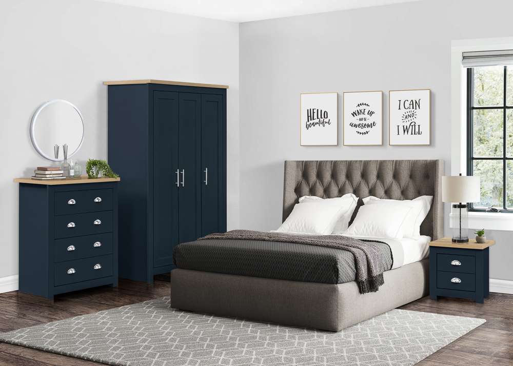 A blue in grey bedroom and wooden floor and grey bed and rug on it