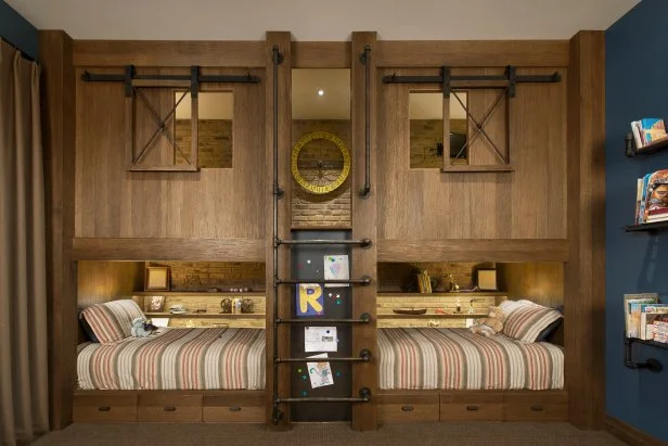 A wooden bunk bed and wooden floor and stair and bed