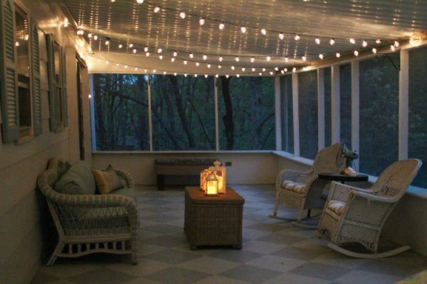 A string lights in sunroom with wooden floor