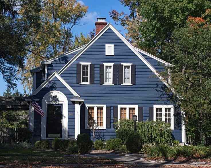 Navy blue house with white trim and black shutter