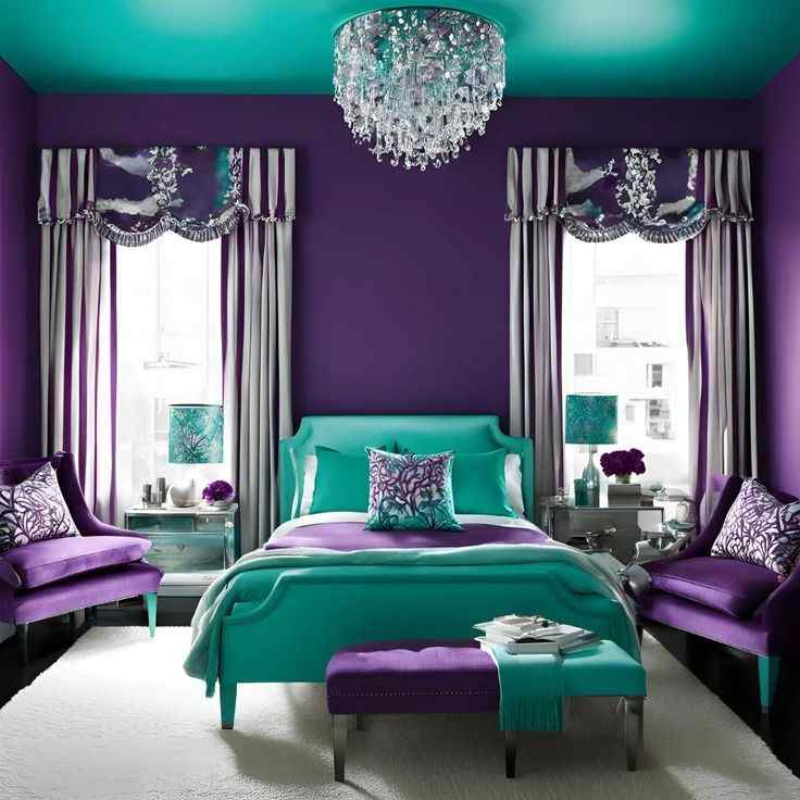 A bedroom with purple and teal and chair and wooden floor