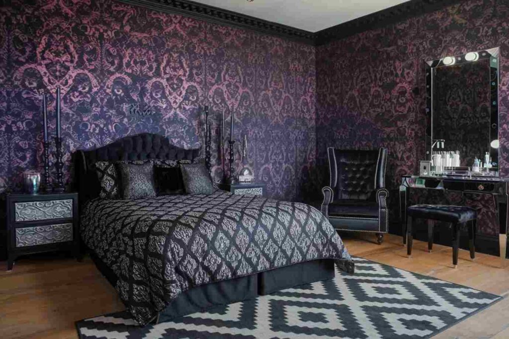 A two tone wall in gothic bedroom with mirror on the wall and wooden floor