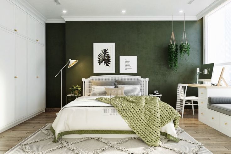 A green bedroom white wall wooden floor and hang plants 
