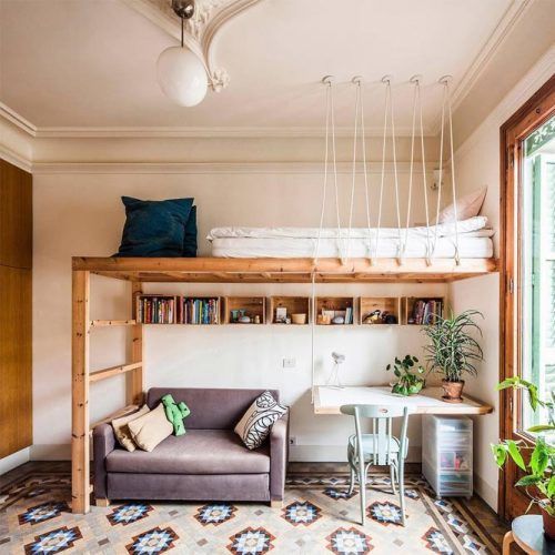 A wooden loft bed and sitting area and windows ad shelves 